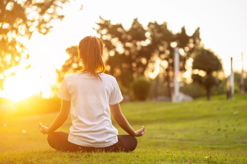 woman meditating outside