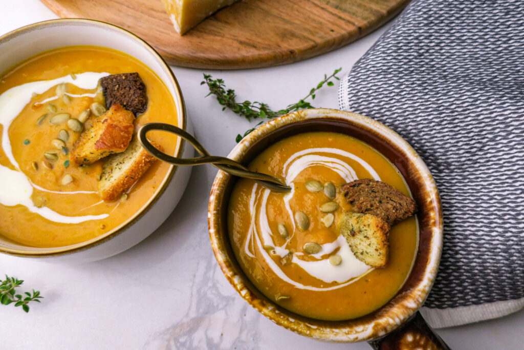Creamy fall vegetable soup with toasted pepitas and fresh thyme